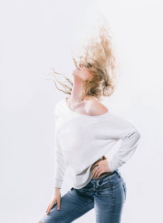 Portrait of glamorous young woman in jeans.の写真素材