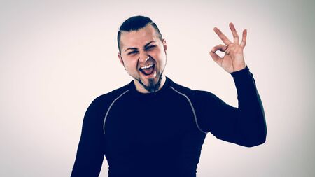 concept of victory in sports-happy bodybuilder rejoice their vic