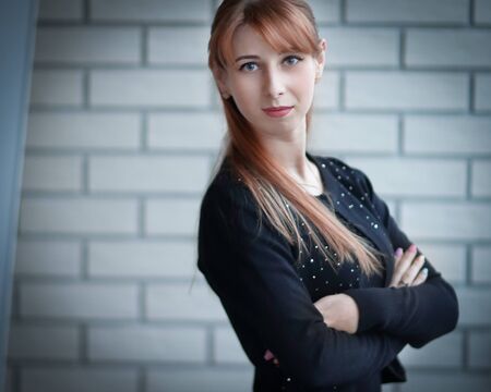 young business woman standing in the corridor of the office.の写真素材