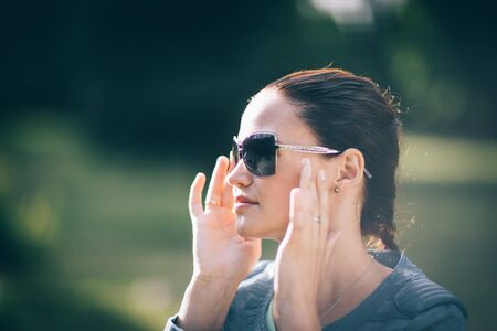 close up. beautiful modern girl in sunglassesの写真素材