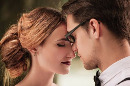 portrait of bride and groom looking at each otherの写真素材