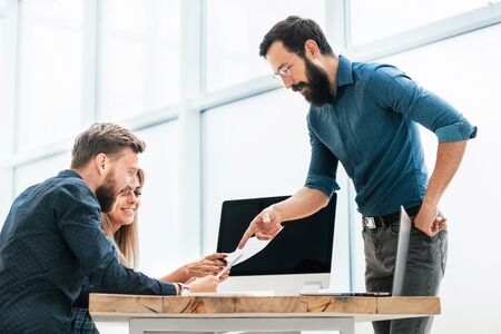 young professionals work with business documentation in the new office