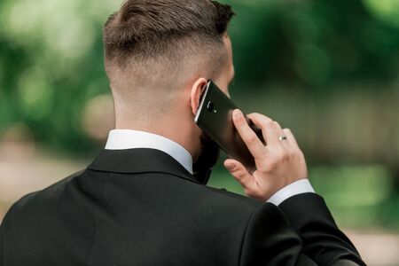 close up. businessman talking on his smartphoneの写真素材