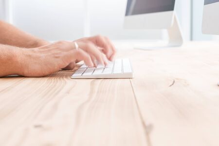 background image of a man working on a computer
