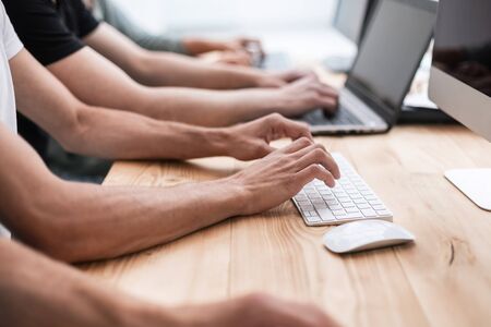 close up. a group of employees work on their computersの写真素材
