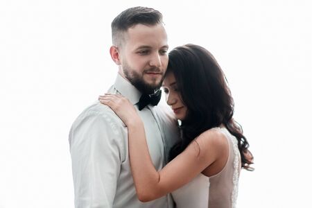 Bride and groom talking standing near the windowの写真素材