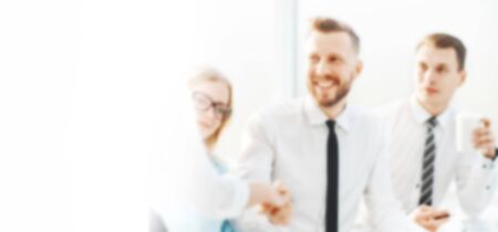businessman shaking hands with his business partner. blurred image for the advertising text. photo...