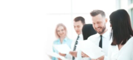 blurred image for the advertising text. young business team discussing business documents. business...