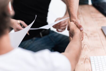 close up. welcome handshake business people in the officeの写真素材