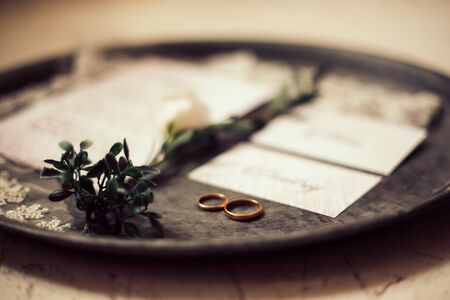 close up.wedding rings on a silver tray.の写真素材