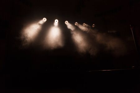 bright spotlights in the dark. stage lightingの写真素材