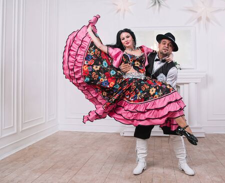 charismatic man and woman performing a fast Gypsy dance.の写真素材