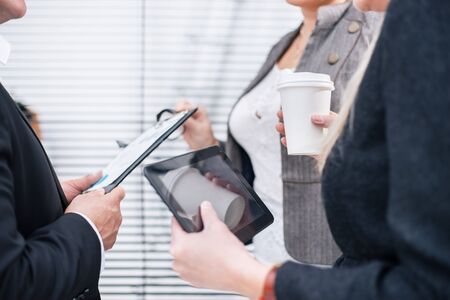 close up. group of employees discussing current tasks.の写真素材