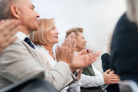 close up. seminar participants applaud in the conference room.の写真素材