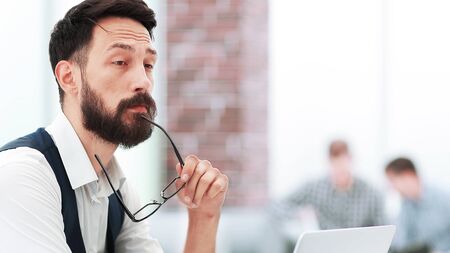 businessman thinking about something, sitting at the office Desk