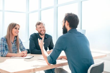 group of business people sitting at the office table.