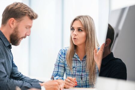 close up. two employees sitting at the Desk