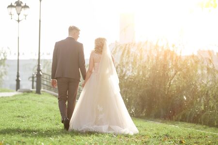 bride and groom on a walk in the city Park. photo with copy spaceの写真素材