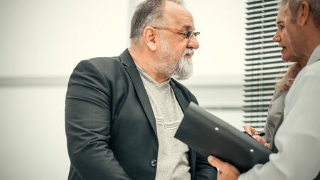 close up. project Manager talking to employeesの写真素材