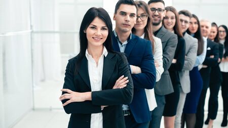 group of confident young people standing in a row