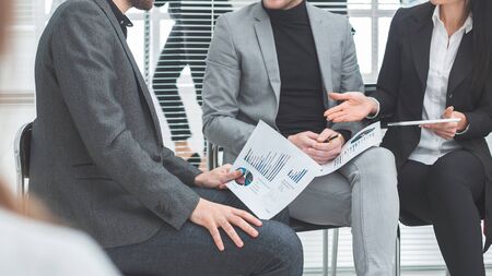 business colleagues discussing financial data in a conference room. business concept