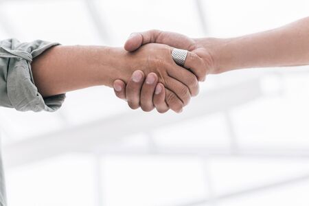 close up. handshake business partners on blurred office background .