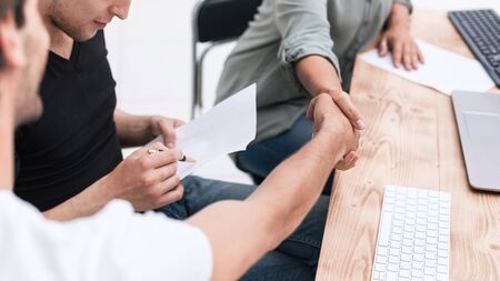 close up. handshake employee near the desktop.の写真素材