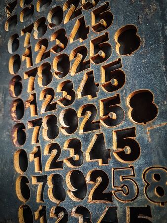 fragment of a concrete wall with embossed numbers.の写真素材