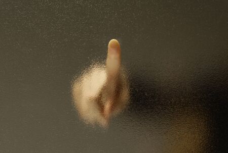 Touch a finger through the frosted glass.