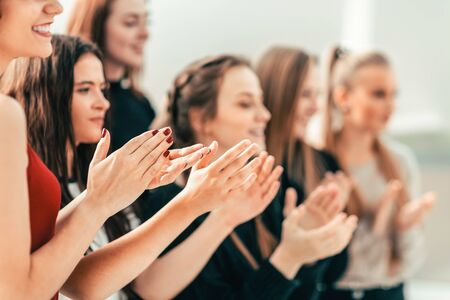 close up. diverse young people applauding together .の写真素材