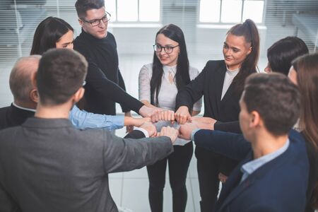 close up. a team of young professionals standing in a circleの写真素材