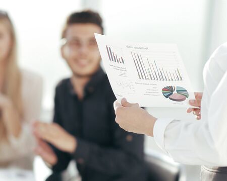 rear view. business woman with financial schedule standing in th