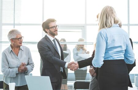 business people shaking hands at an office meeting