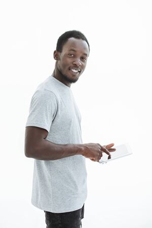 handsome modern guy with a digital tablet. isolated on whiteの写真素材