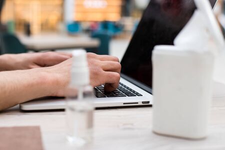 close up. employee works on a laptop during the quarantine period.