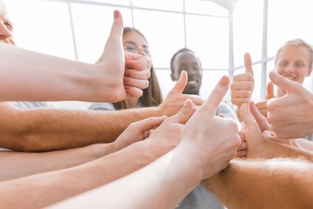 close up. a group of young like-minded people showing their suc