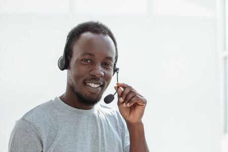 close up. a handsome young man with a headset.の写真素材