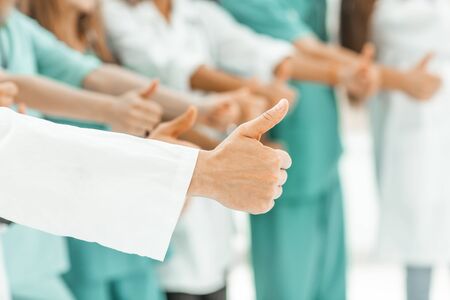 close up. group of doctors showing thumbs up. success conceptの写真素材