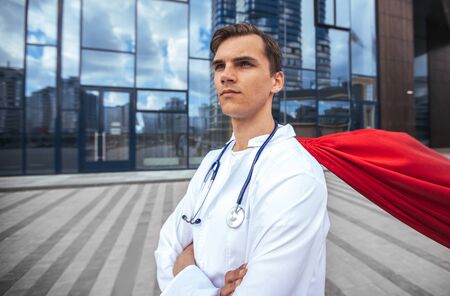 close up. paramedic superhero standing on a city street.の写真素材