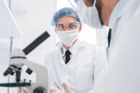 group of scientists discussing the results of testing.