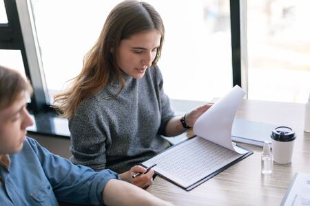 close up. young woman working with business documents.の写真素材