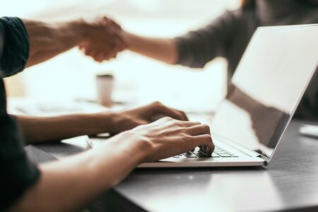 close up. image of a man working on an office laptop .の写真素材