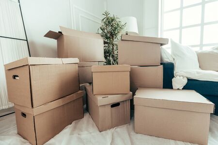 lot of cardboard boxes in the new apartment. photo with a copy-space.の写真素材