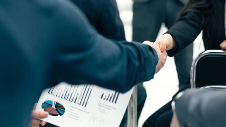 business colleagues shaking hands with each other during the workshop . business conceptの写真素材