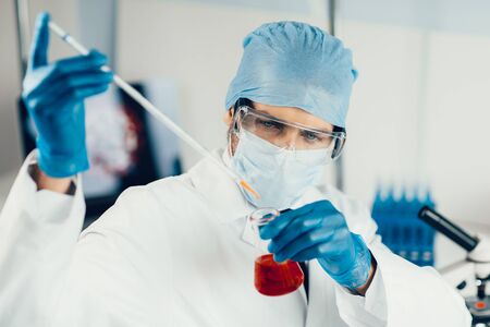 close up. scientist conducts research in the laboratory.の写真素材