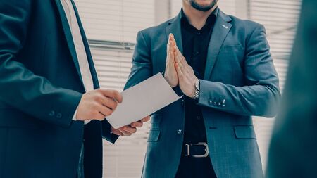 close up. employee applauding at a meeting of business partners .の写真素材