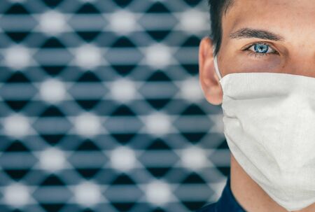close up. a young man in a protective mask