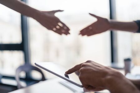close up. young woman using her smartphone at work in the office .の写真素材