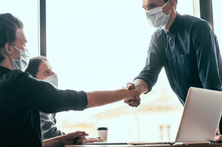 close up. financial partners are shaking hands with each other .