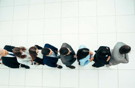 top view. diverse business of people standing in line for interviews.